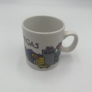 Las Vegas Espresso Cup Small Has Buildings and cars on Front White.
